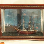 Cedar model ship in cedar and glass case