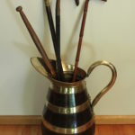 Oak brass bound stick or umbrella stand in the shape of a jug