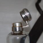Early 20th century glass hunting flask in leather case