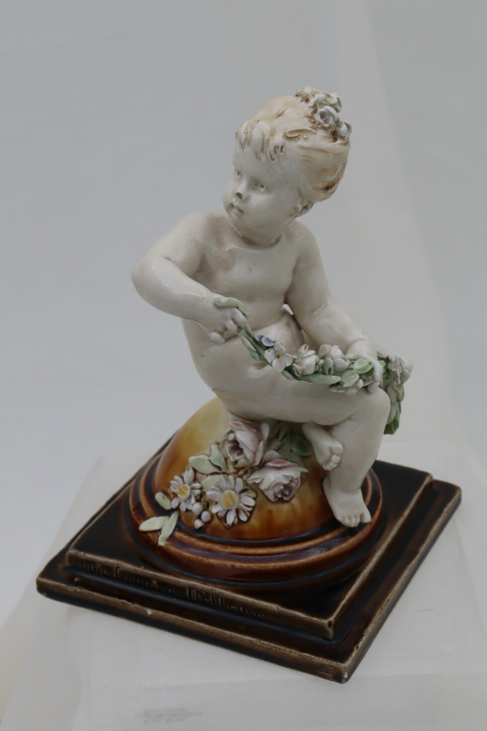 Cherub figurine by Louis Carrier-Belleuse