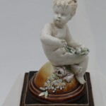 Cherub figurine by Louis Carrier-Belleuse