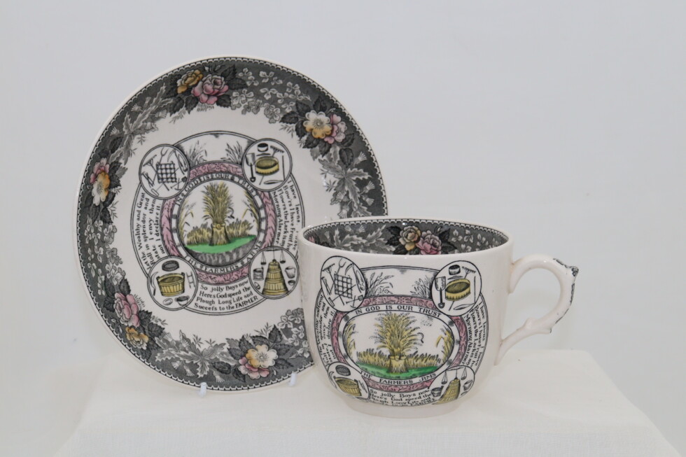 Large cup and saucer entitled "The Farmer's Arms"