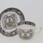 Large cup and saucer entitled "The Farmer's Arms"